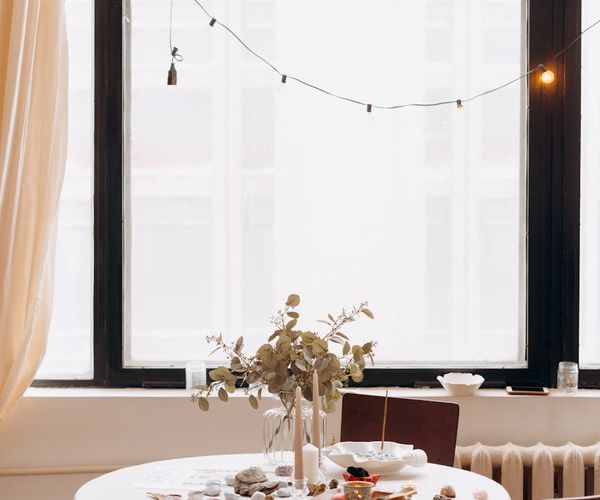 A serene setting with yoga mat, candles, and soft lighting, creating a relaxing atmosphere.
